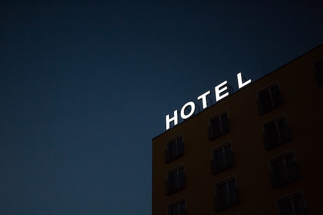 light up sign saying "hotel"